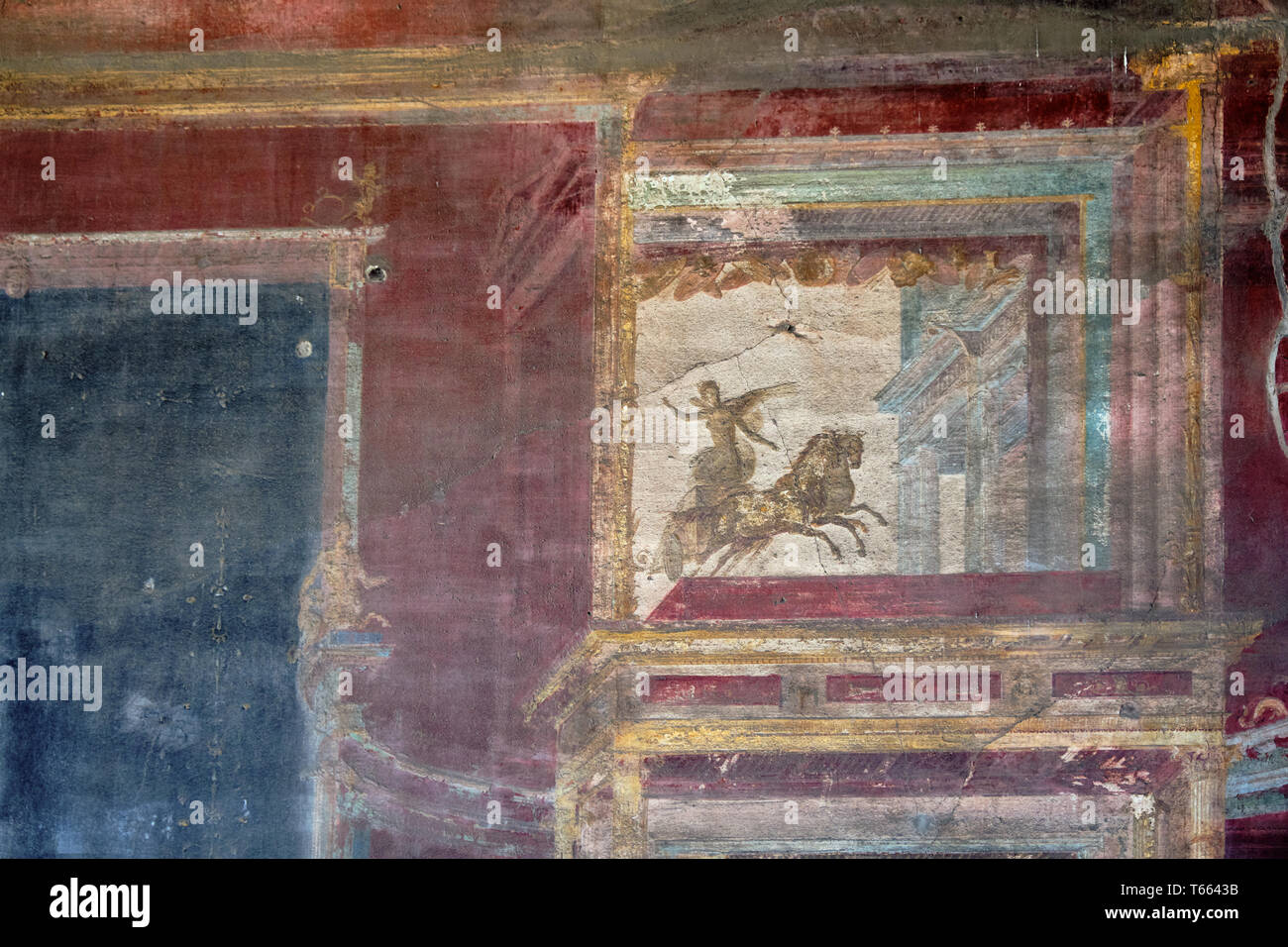 Ancient Pompei fresco of a winged soldier on a chariot Stock Photo