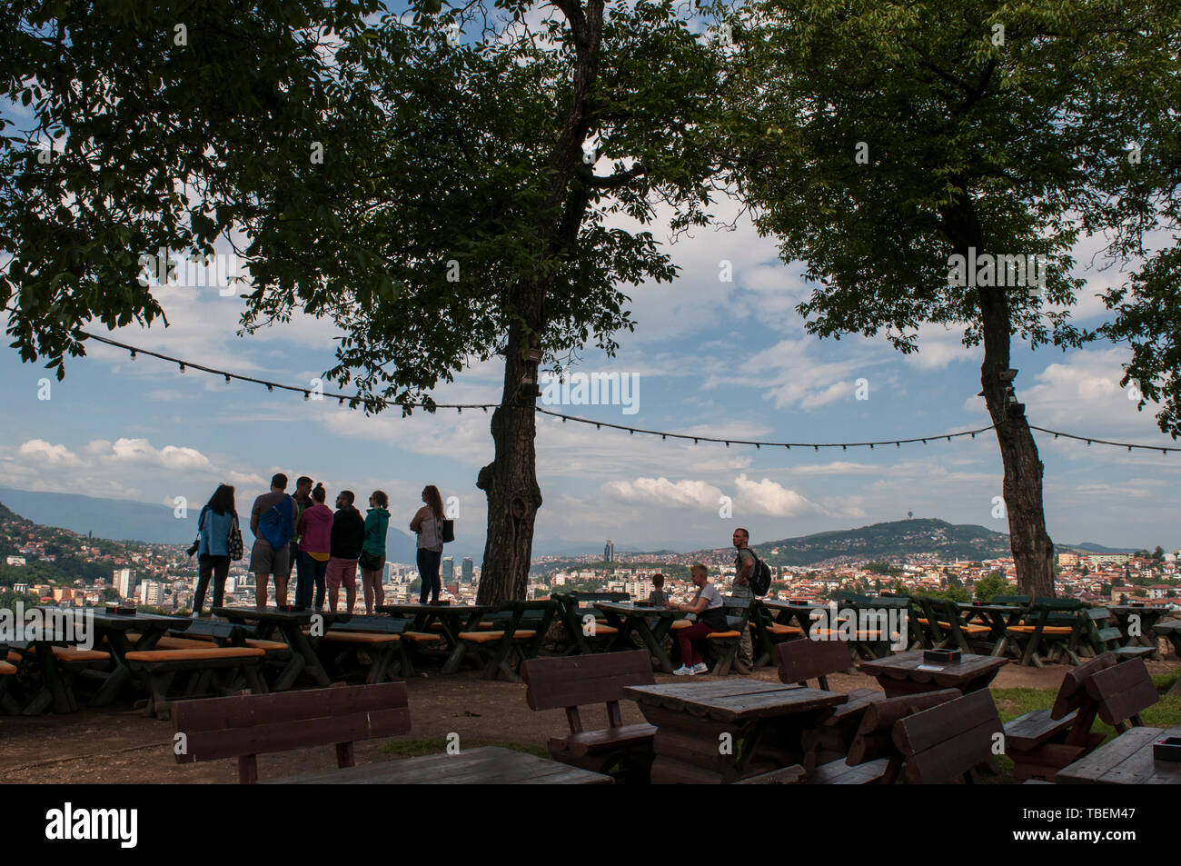 Sarajevo, Bosnia: people looking at the skyline of the city with the Dinaric Alps and Miljacka River from the top of Zuta Tabija (Yellow Fortress) Stock Photo