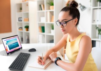 Woman working remotely using a Dell Latitude 5330 and wireless keyboard and mouse.