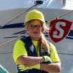 Portrait shot of an employee in front of the Stena Line ferry