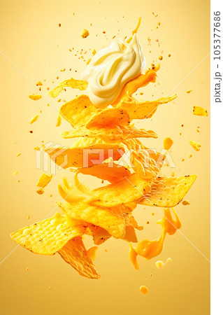 Potato chips with cheese sauce on a yellow background. Levitation. 105377686